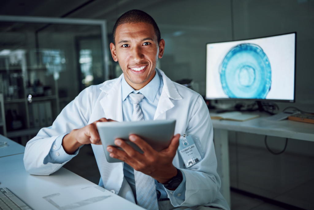 Male doctor looking at Xray's smiling.