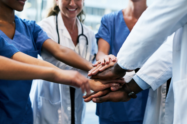 Healthcare professionals celebrating teamwork